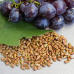 Grapes and grape seeds on the table